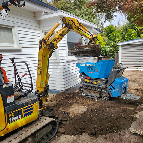 Digger Loading Tracked Dumper